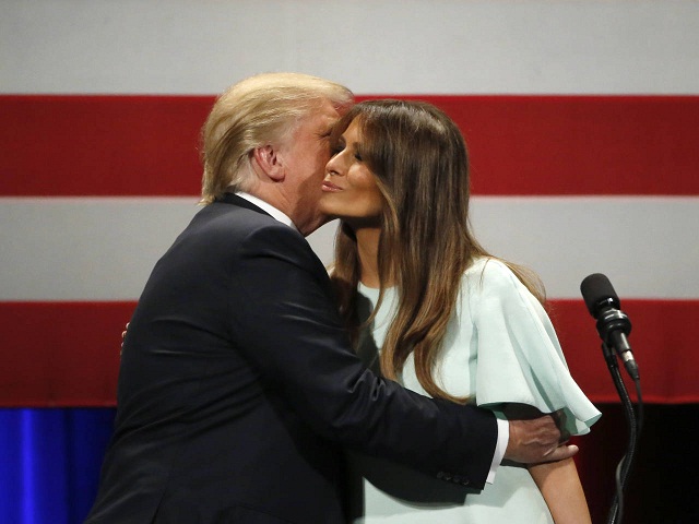 Republican presidential candidate, Donald Trump, left, kisses his wife Melania after she addressed the crowd during a rally at the Milwaukee Theatre Monday, April 4, 2016, in Milwaukee. (AP Photo/Charles Rex Arbogast)